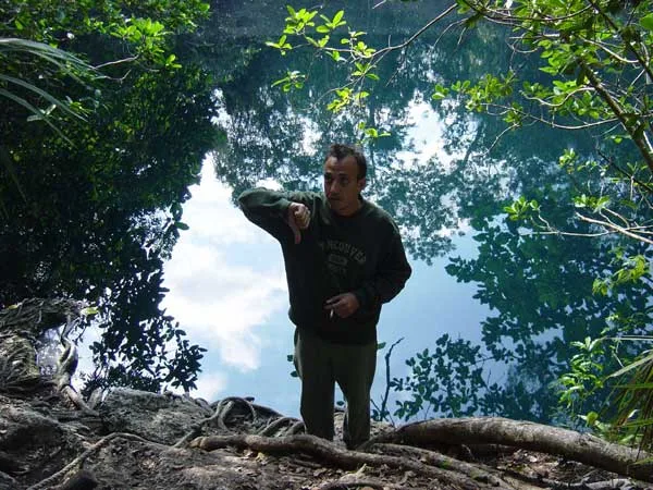 Diver preparing near a cenote opening